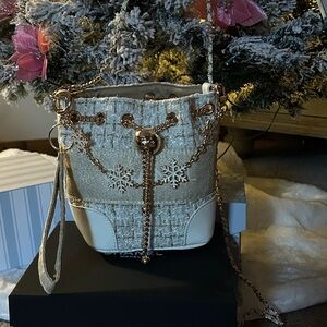 Beaute CC Crossbody Cream and Gold Bucket Bag with Snowflake details
